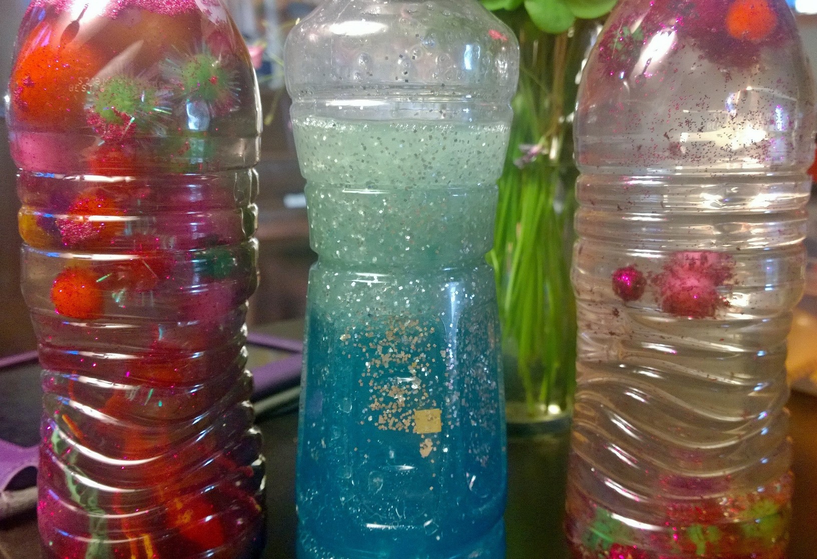 Sparkling and dangling sensory bottles